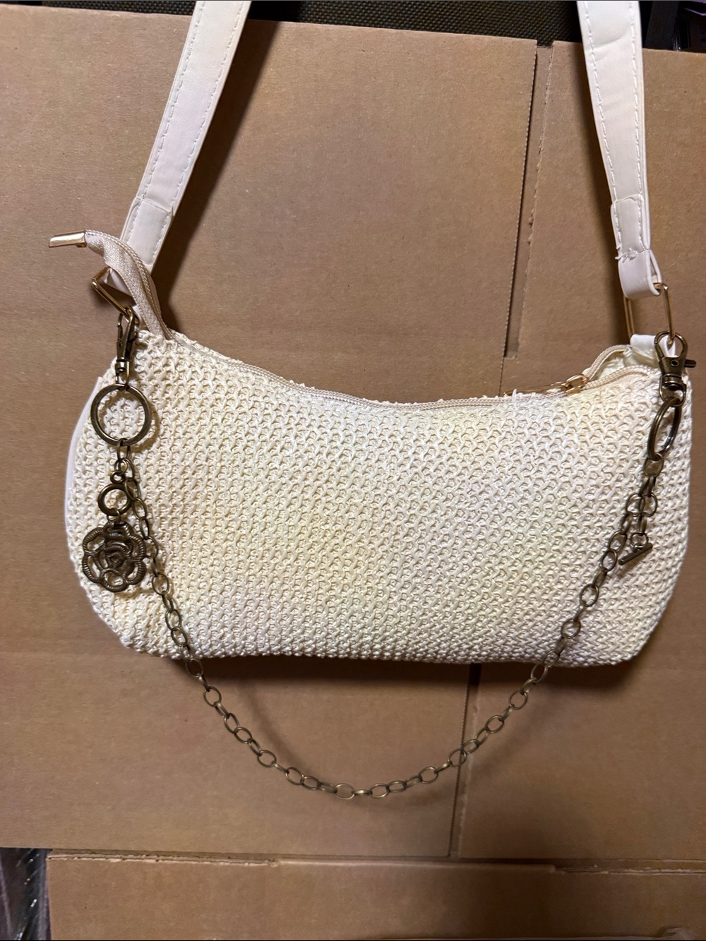 Woven Cream Shoulder Bag with Chain Accent. Bag not for sale